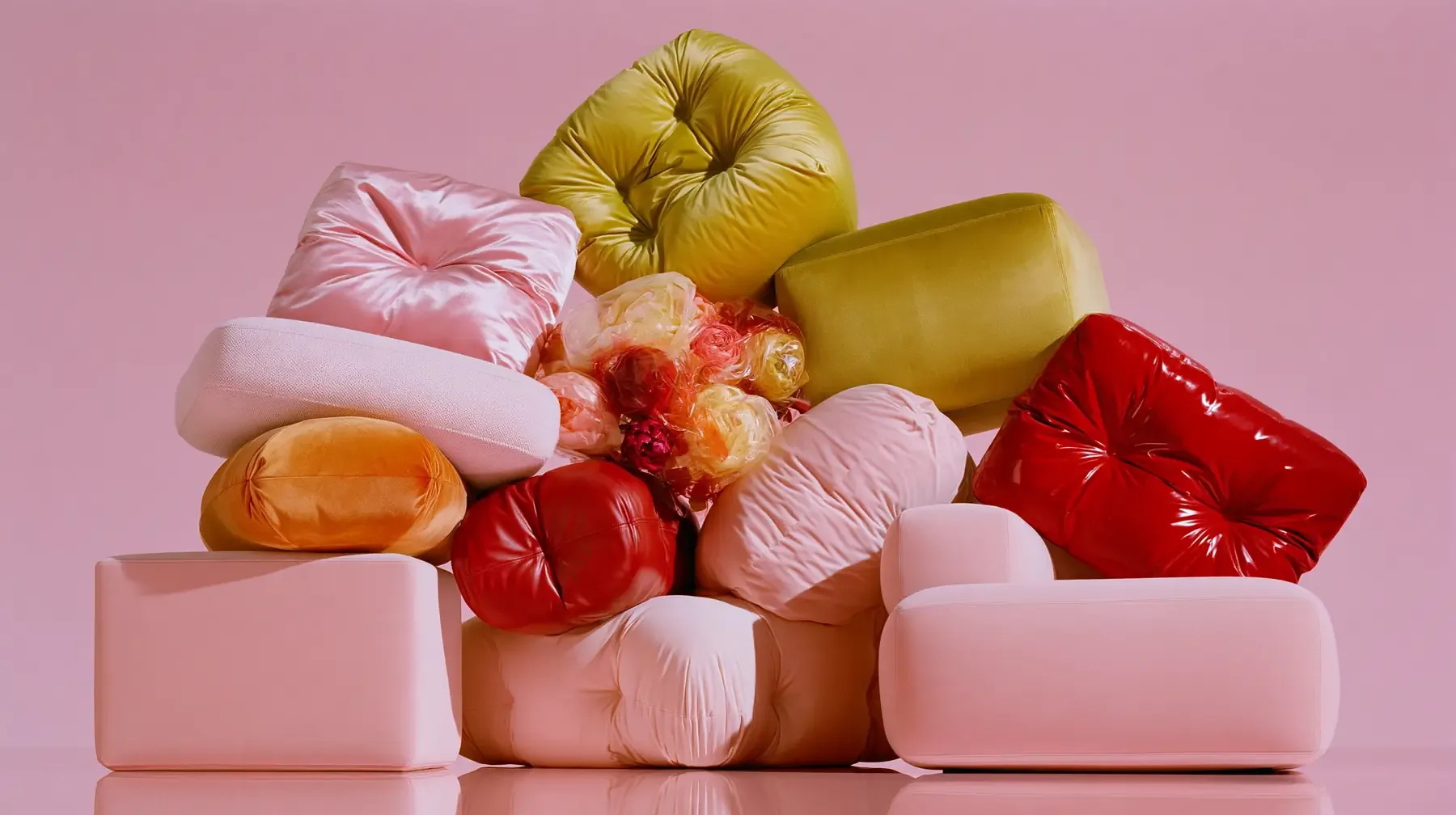Soft sculptural cushions and fruit in the palette of comfort